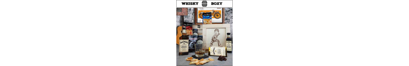 Debny s obsahom premiovych whisky a karikatúrou na veku debny
